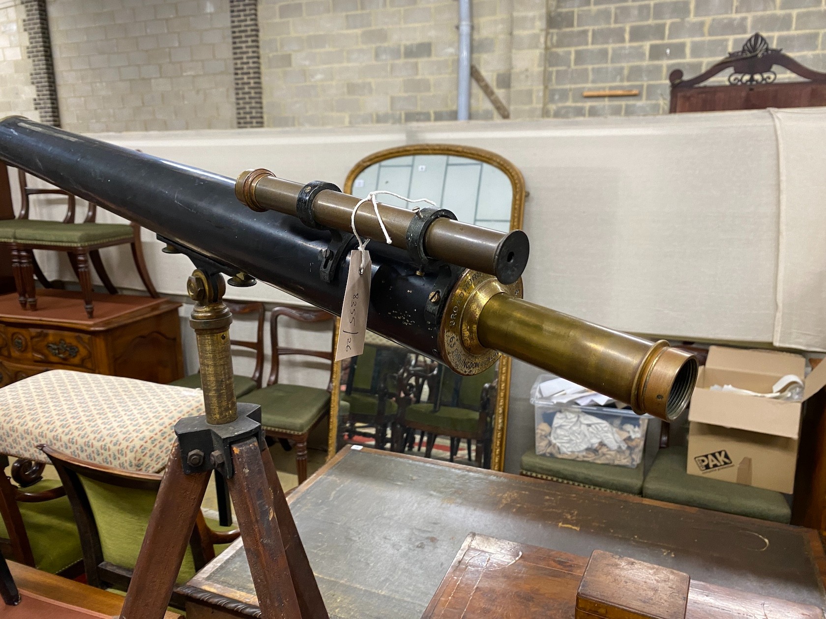 An early 20th century, Broadhurst and Clarkson astronomical telescope on folding tripod, the telescope length 110cm